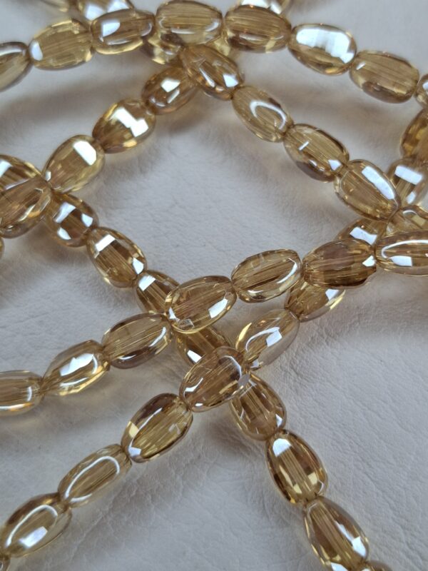 Tira cristal oval dorado claro