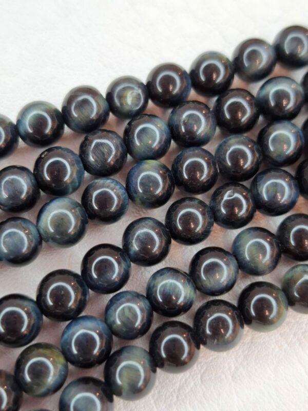 Tira ojo tigre negro 8mm